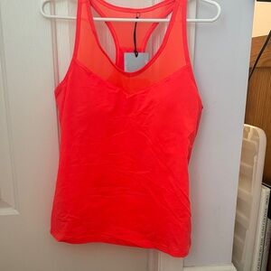 Fila tank top. UPF 50. Built in bra shelf with removable pads. NWT Size M.